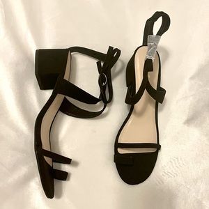 Low heeled ankle strap sandals.